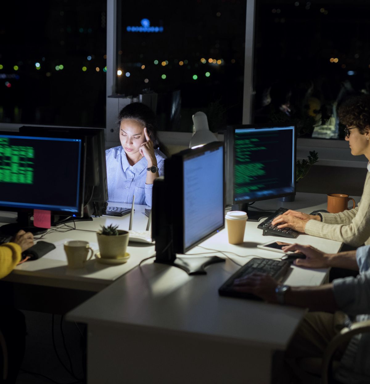 Online Ads team working on a product in the office late in the evening